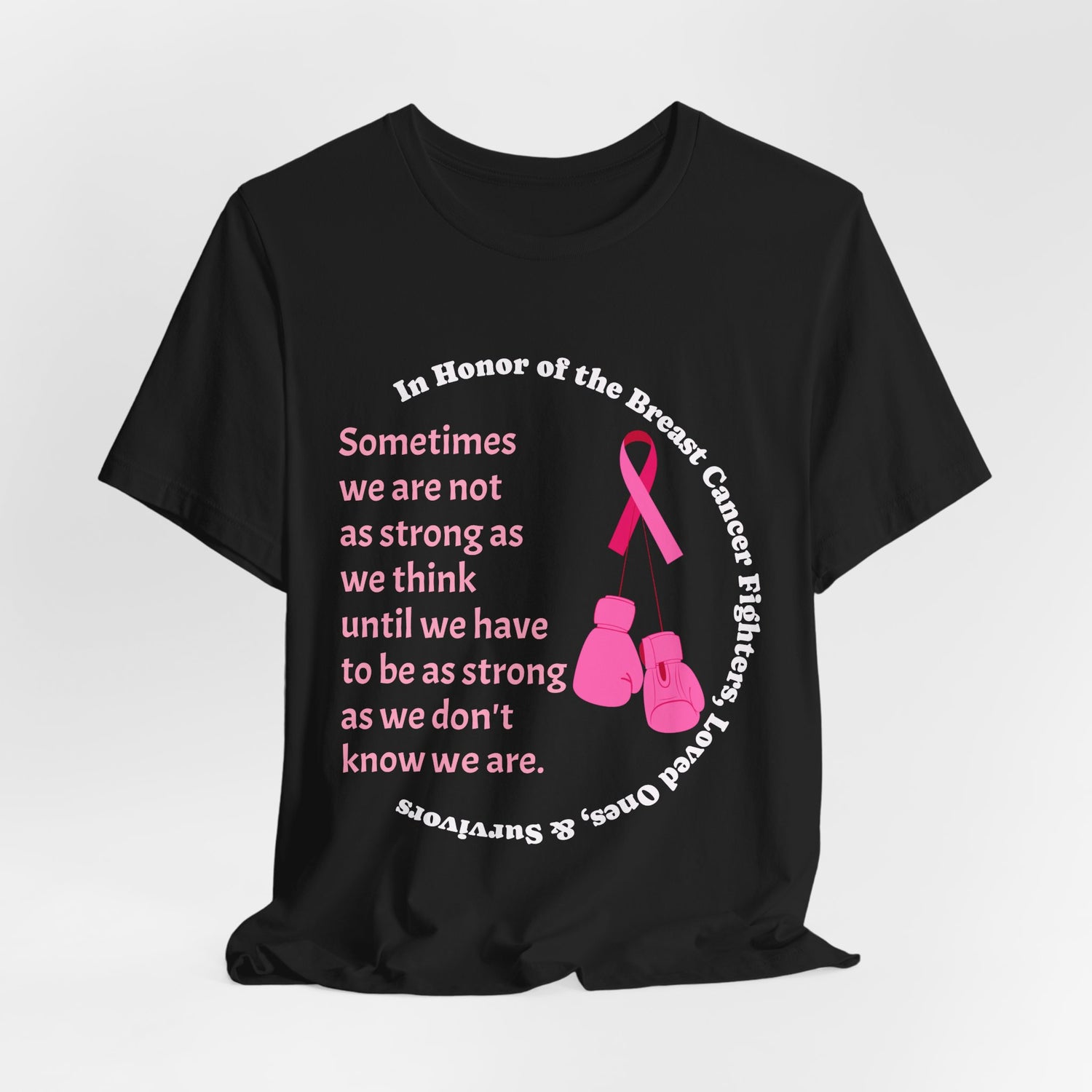 Black t-shirt with pink breast cancer awareness design and text on a white background